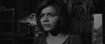Movie still from “Rapture” (1965), directed by John Guillermin – A black - and - white photo of a woman looking at the camera; Close Up shot, Low angle