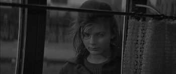 Movie still from “Rapture” (1965), directed by John Guillermin – A young woman looking out of a train window; Close Up shot, High angle