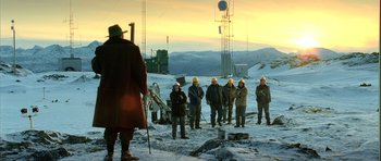 Movie still from “Rare Exports” (2010), directed by Jalmari Helander – A group of men standing on top of a snow covered slope; Extreme Wide shot, Low angle