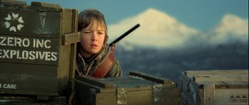 Movie still from “Rare Exports” (2010), directed by Jalmari Helander – A young boy holding a wooden stick in his mouth; Close Up shot, Low angle