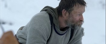 Movie still from “Rare Exports” (2010), directed by Jalmari Helander – A person wearing a sweater; Close Up shot, Over the shoulder angle
