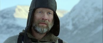 Movie still from “Rare Exports” (2010), directed by Jalmari Helander – A person wearing a hat; Close Up shot, Low angle