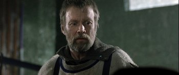 Movie still from “Rare Exports” (2010), directed by Jalmari Helander – A person with a beard; Close Up shot, Over the shoulder angle