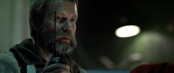 Movie still from “Rare Exports” (2010), directed by Jalmari Helander – A man with a long beard holding a cell phone; Close Up shot, Low angle