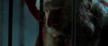 Movie still from “Rare Exports” (2010), directed by Jalmari Helander – A person wearing a santa clause hat; Extreme Close Up shot, Low angle