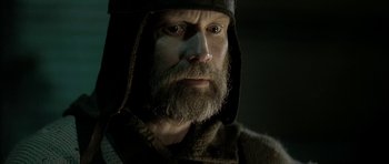 Movie still from “Rare Exports” (2010), directed by Jalmari Helander – A man with a long beard wearing a hood; Close Up shot, Low angle