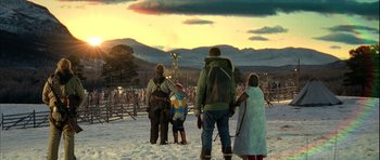 Movie still from “Rare Exports” (2010), directed by Jalmari Helander – A group of people standing on top of a snow covered slope; Wide shot, Low angle
