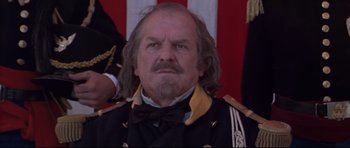 Movie still from “Ravenous” (1999), directed by Antonia Bird – A man in a military uniform with long hair and a beard; Close Up shot, Low angle
