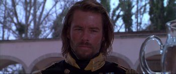 Movie still from “Ravenous” (1999), directed by Antonia Bird – A person with long hair; Close Up shot, Low angle