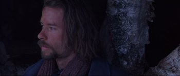 Movie still from “Ravenous” (1999), directed by Antonia Bird – A person with long hair; Close Up shot, Low angle