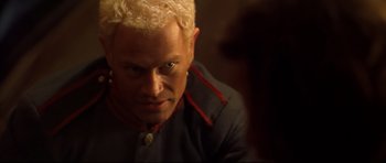 Movie still from “Ravenous” (1999), directed by Antonia Bird – A person wearing a uniform; Close Up shot, Over the shoulder angle