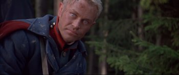 Movie still from “Ravenous” (1999), directed by Antonia Bird – A person wearing a uniform; Close Up shot, Low angle