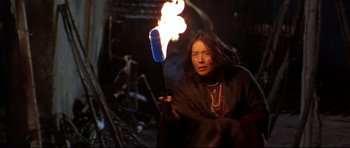 Movie still from “Ravenous” (1999), directed by Antonia Bird – A woman holding a lit candle in her hand; Medium shot, Low angle