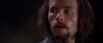 Movie still from “Ravenous” (1999), directed by Antonia Bird – A person with long hair; Close Up shot, Low angle