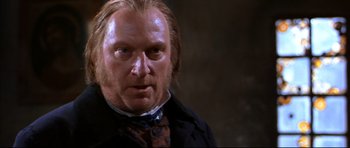 Movie still from “Ravenous” (1999), directed by Antonia Bird – A person with long hair; Close Up shot, Over the shoulder angle