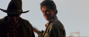Movie still from “Razorback” (1984), directed by Russell Mulcahy – A person wearing a hat; Close Up shot, Over the shoulder angle