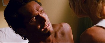Movie still from “Razorback” (1984), directed by Russell Mulcahy – A man's face in the sunlight; Close Up shot, High angle