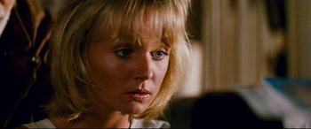 Movie still from “Razorback” (1984), directed by Russell Mulcahy – A person with blonde hair and blue eyes; Close Up shot, Over the shoulder angle