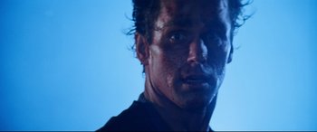 Movie still from “Razorback” (1984), directed by Russell Mulcahy – A man's face covered in blood; Close Up shot, Low angle