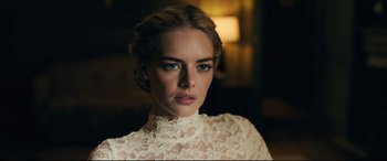 Movie still from “Ready or Not” (2019), directed by Matt Bettinelli-Olpin – A woman in a white dress with blue eye shadow; Close Up shot, Low angle