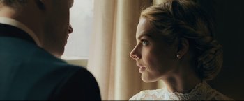 Movie still from “Ready or Not” (2019), directed by Matt Bettinelli-Olpin – A person looking at a person; Close Up shot, Over the shoulder angle