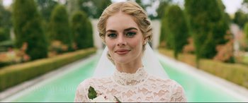 Movie still from “Ready or Not” (2019), directed by Matt Bettinelli-Olpin – A beautiful young lady wearing a wedding dress and veil; Close Up shot, Over the shoulder angle