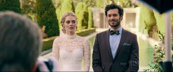Movie still from “Ready or Not” (2019), directed by Matt Bettinelli-Olpin – A man and a woman standing next to each other in front of bushes; Close Up shot, Over the shoulder angle
