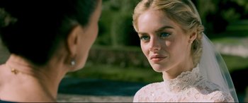 Movie still from “Ready or Not” (2019), directed by Matt Bettinelli-Olpin – A woman in a white dress talking to another woman; Close Up shot, Over the shoulder angle