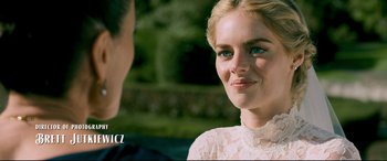 Movie still from “Ready or Not” (2019), directed by Matt Bettinelli-Olpin – A beautiful young woman wearing a white dress; Close Up shot, Over the shoulder angle