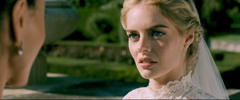 Movie still from “Ready or Not” (2019), directed by Matt Bettinelli-Olpin – A person wearing a white dress; Close Up shot, Over the shoulder angle