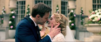 Movie still from “Ready or Not” (2019), directed by Matt Bettinelli-Olpin – A man and a woman are kissing each other outside; Close Up shot, Over the shoulder angle