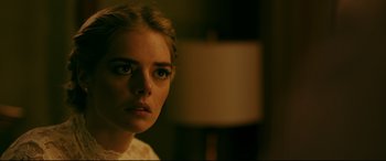 Movie still from “Ready or Not” (2019), directed by Matt Bettinelli-Olpin – A person wearing a white shirt; Close Up shot, Over the shoulder angle