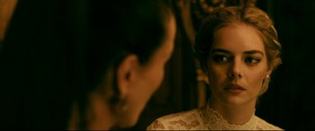 Movie still from “Ready or Not” (2019), directed by Matt Bettinelli-Olpin – Two women are looking at each other in the mirror; Close Up shot, Over the shoulder angle