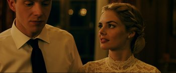 Movie still from “Ready or Not” (2019), directed by Matt Bettinelli-Olpin – A beautiful young lady wearing a white dress; Close Up shot, Over the shoulder angle