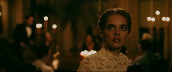 Movie still from “Ready or Not” (2019), directed by Matt Bettinelli-Olpin – A beautiful young lady wearing a white lace dress; Close Up shot, Over the shoulder angle