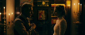 Movie still from “Ready or Not” (2019), directed by Matt Bettinelli-Olpin – A man and a woman standing next to each other in a room; Medium shot, Over the shoulder angle