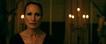 Movie still from “Ready or Not” (2019), directed by Matt Bettinelli-Olpin – A person wearing a black shirt; Close Up shot, Over the shoulder angle
