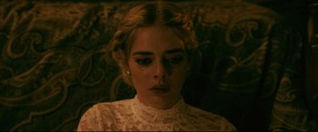 Movie still from “Ready or Not” (2019), directed by Matt Bettinelli-Olpin – A young woman in a white lace dress crying; Close Up shot, High angle