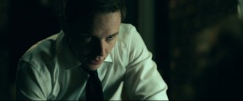 Movie still from “Ready or Not” (2019), directed by Matt Bettinelli-Olpin – A man wearing a white shirt and a black tie; Close Up shot, Low angle