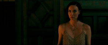 Movie still from “Ready or Not” (2019), directed by Matt Bettinelli-Olpin – A beautiful woman in a dress standing next to a door; Close Up shot, Over the shoulder angle