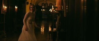 Movie still from “Ready or Not” (2019), directed by Matt Bettinelli-Olpin – A beautiful young lady in a long white dress; Wide shot, Over the shoulder angle