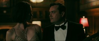 Movie still from “Ready or Not” (2019), directed by Matt Bettinelli-Olpin – A man and a woman are standing next to each other; Close Up shot, Over the shoulder angle