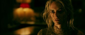 Movie still from “Ready or Not” (2019), directed by Matt Bettinelli-Olpin – A person with long blonde hair; Close Up shot, Over the shoulder angle