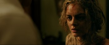 Movie still from “Ready or Not” (2019), directed by Matt Bettinelli-Olpin – A person with makeup on their face; Close Up shot, Over the shoulder angle