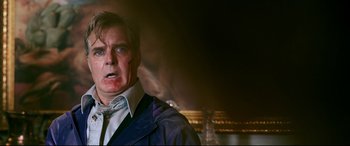 Movie still from “Ready or Not” (2019), directed by Matt Bettinelli-Olpin – A person wearing a suit and tie; Close Up shot, Low angle