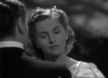 Movie still from “Rebecca” (1940), directed by Alfred Hitchcock – A man and a woman in a black and white photo; Close Up shot, Over the shoulder angle