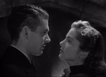 Movie still from “Rebecca” (1940), directed by Alfred Hitchcock – A man and a woman looking at each other; Close Up shot, Low angle