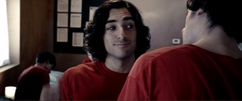 Movie still from “Hostage 911” (2018), directed by Robert Rodriguez – A person wearing a red shirt; Close Up shot, Over the shoulder angle