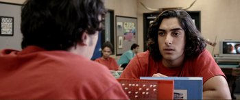 Movie still from “Hostage 911” (2018), directed by Robert Rodriguez – A man sitting in front of a mirror in front of another man; Close Up shot, Over the shoulder angle