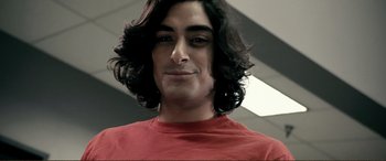 Movie still from “Hostage 911” (2018), directed by Robert Rodriguez – A person wearing a red shirt; Close Up shot, Low angle